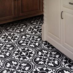 a black and white tile floor in a kitchen