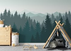 a child's room with a teepee tent and mountains in the back ground