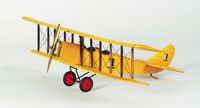 a yellow toy airplane with red wheels on a white background and no people around it