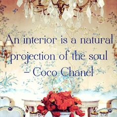 an interior is a natural projection of the soul coco chanel quote on dining room table