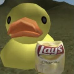 a yellow rubber duck holding a can of lays diapers in front of a mountain