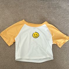 Nwot Great Condition Size Small Smoke Free Home Ships Quickly Bundle To Save!! Playful Smiley Face Tops For Spring, Trendy Smiley Face Summer Tops, Cute Yellow Cotton T-shirt, Cute Spring Tops With Smiley Face, Cute Yellow Summer Tops, Yellow Cotton Short Sleeve Crop Top, Cute Smiley Face Tops For Spring, Yellow Cotton Crop Top With Short Sleeves, Cute Smiley Face Top For Spring