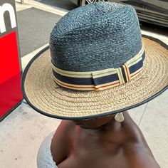 This Straw Hat Is Made From Shantung Straw And Has A Unique Teardrop Fedora Design With An Asymmetrical Brim. The Crown Measures 4" High. Blue Brimmed Sun Hat For Day Out, Blue Brimmed Hat For Day Out, Blue Wide Brim Hat For Day Out, Casual Blue Straw Panama Hat, Blue Wide-brim Hat For Day Out, Blue Casual Hat For Day Out, Casual Blue Fedora For Vacation, Blue Fedora Hat For Travel, Blue Hat Band For Spring Vacation