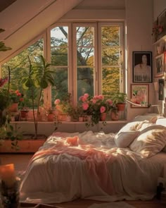 a bedroom with lots of plants in the window sill