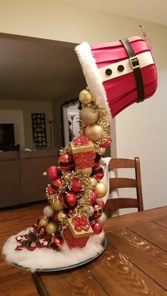 a christmas tree with santa claus's hat on top