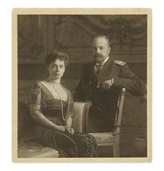 an old black and white photo of two people