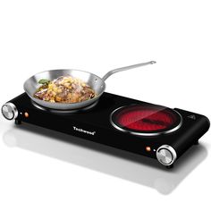 an electric stove top with a pan on it