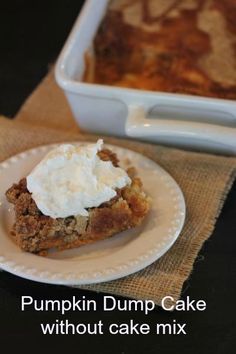 a piece of cake sitting on top of a white plate next to a casserole dish