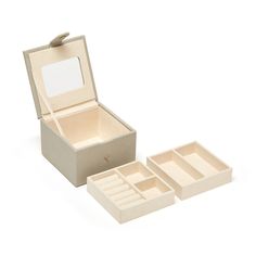 an open jewelry box with four compartments