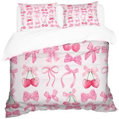 a bed with pink bows and cherries on the pillowcase, along with two matching shampoos