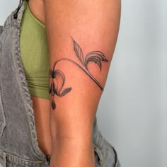 a woman with a tattoo on her arm