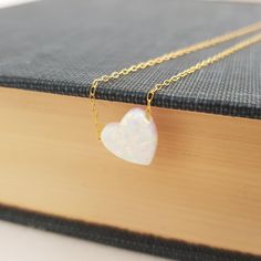 Fall in love with this delicate white heart opal pendant displayed on a 14K gold filled chain. This dainty opal jewelry is a perfect gift for a special person. A fantastic present to give as Valentine's day gift. Dainty White Heart Necklace For Her, White Dainty Jewelry For Valentine's Day, Dainty White Jewelry For Valentine's Day, White Heart Cut Necklace For Her, White 14k Gold Heart Necklace For Gift, 14k Gold White Heart Necklace For Gift, Dainty White Heart Necklace With Delicate Chain, Minimalist White Heart Necklace For Wedding, Valentine's Day 14k Gold White Heart Necklace