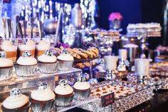 an assortment of desserts and pastries on display at a party or wedding reception