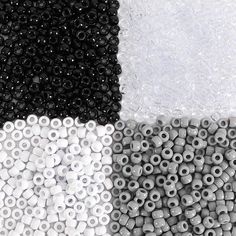 several different types of beads are shown in this image, one is white and the other is black