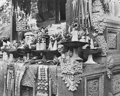 an old black and white photo of many items on display