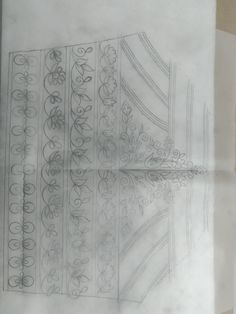 a drawing of an ornate design on paper