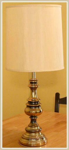 a lamp sitting on top of a wooden table