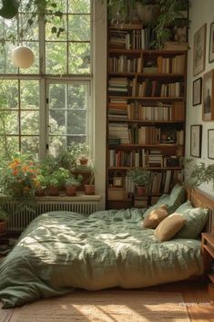 a bed sitting under a window next to a book shelf filled with lots of books