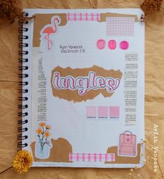 an open notebook with stickers and flowers on it