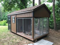 a dog house with a fence around it