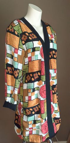 Colourful Vintage Blazer/ Coverup  DINO CLASSIC Made in Canada. It is a ladies size 8 but its very loose and full and would fit a 10. It feels like a light weight silk but it is 100% polyester and washable. The colours are as bright on the reverse side. There are two front pockets, shoulder pads and black cuffs. It falls to mid thigh. Versatile  piece to add to your wardrobe. Colourful Blazer, Vintage Blazer, Womens Blazers, It's Fall, Colored Blazer, Vintage Colors, Vintage Pink, Shoulder Pads, Blazer Suit