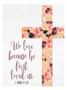 a cross with flowers on it that says, we love because he first loved us