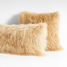 two furry pillows sitting next to each other