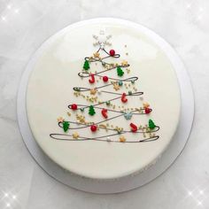 a white plate with a decorated christmas tree on it