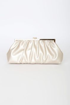 The Lulus Capture the Love Champagne Oversized Clutch can hold more than just the essentials, it can also keep your heart! This flexible faux leather clutch has a slightly metallic finish, a gathered silhouette, and a top clasp closure with gold hardware throughout. Lined interior boasts a sidewall pocket and a detachable gold chain strap. Lined. Clutch Measures 12" Wide, 6. 25" Tall, And 2. 5" Deep Relaxed. Detachable 45" Gold Chain Strap. Strap Has A 22â€ Drop. Shell: 100% Polyurethane. Linin Nude Bags, Nude Clutch, Prom Bag, Prom Purse, Formal Clutch, Prom Inspo, Cream Bags, Wedding Bags, Oversized Clutch