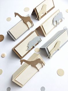 several pieces of paper with animals cut out of them