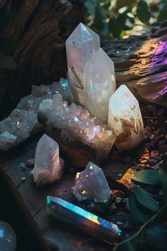 some crystals are sitting on the ground next to rocks