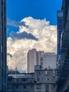 some buildings and clouds in the sky