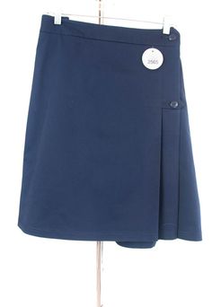 Description: - two off centered pleats in the front and the back- back elastic waist- single button front closure with small pocket- extremely durable- stain resistant fabric- great looking the entire school year! Fabric Content: 64% Poly / 34% Cotton 2% Elastene Care Instructions: Machine Wash, Tumble Dry Actual Garment Measurements: Elastic Waist: 43 - 48" Low Hip: 54" Length: 22" Classic Short Pleated Waist Skort, Classic Pleated Waist Short Skort, Classic Short Pleated Skort, Classic Cotton Mini Pleated Skirt, Classic Cotton Pleated Mini Skirt, School Uniform Lined Skirt, Cotton Pleated Skort For School Uniform, School Uniform Pleated Skirt With Accordion Pleats, School Uniform Pleated Skort