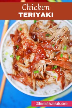 chicken teriyaki on top of rice in a white bowl with chopsticks