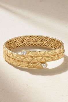 Marina B's 'Triangolini' bangle is defined by its triangular engraving - an intricate detail seen on every piece in the 'Triangoli' collection. Handmade from 18-karat gold, it has a stacked design that wraps comfortably around your wrist and is tipped with a cluster of pavé diamonds. Luxury Engraved Diamond Bracelet, Luxury Diamond Cut Bangle, Luxury Stackable Bangle For Formal Occasions, Luxury Stackable Bangle For Formal Events, Elegant Yellow Gold Triangle Jewelry, Elegant Triangle Yellow Gold Jewelry, Luxury Stackable Cuff Bracelet For Everyday, Luxury Stackable Diamond Bracelet, Luxury Stackable Bangle