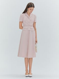 This product, the Erika Flare Dress, encapsulates a timeless elegance with a fitted bodice that flares into a graceful midi-length skirt. The addition of a matching belt enhances the dress's classic silhouette, drawing attention to the wearer's waist. It features a neatly tailored collar and a sleek button-down front, which add a touch of formality to the otherwise soft-flowing form. - This Erika Flare Dress includes a neatly tailored collar that frames the neckline beautifully.- The included belt cinches at the waist, providing a flattering shape and refined detail.- A button-down front offers a versatile closure that is both functional and stylish.- The dress's skirt flares gently from the waist, creating a silhouette that moves with grace and poise. Fit And Flare A-line Midi Dress For Work, Classy Pastel Outfit, Tailored A-line Midi Dress For Work, Classic A-line Midi Dress For Semi-formal Occasions, Chic A-line Tea Length Formal Dress, Workwear Dress With Pleated Waist And Fitted Bodice, Classic A-line Midi Dress With Pleated Waist, Fitted Feminine Dress With Flared Skirt, Feminine Fitted Tea Length Dress For Formal Occasions