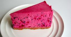 a piece of pink cheesecake on a white plate