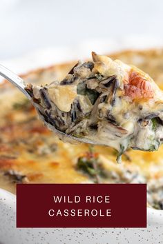 a spoon full of wild rice casserole with text overlay that reads wild rice casserole