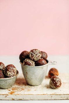 chocolate truffle bites in a metal bowl on a wooden table with other ingredients