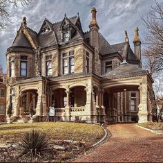 an old victorian style house in the fall