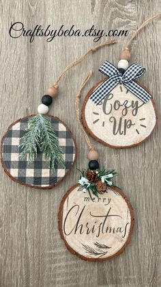 three wooden ornaments with christmas decorations on them