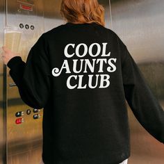 Cool Aunts Club Sweatshirt Promoted To Aunt Sweater New Aunt Gift Aunt Birthday Gift Pregnancy Reveal Aesthetic Crewneck Words On Back * This item is printed with direct-to-garment printing. This means the design will look a bit more vintage and have a little more texture than other printing methods Product details: * Unisex fit - refer to size chart * 50% cotton, 50% polyester * Pre-shrunk * Classic fit * 1x1 athletic rib knit collar with spandex * Air-jet spun yarn with a soft feel and reduced Black Crew Neck Sweatshirt For Birthday, Black Graphic Print Sweatshirt For Birthday, Casual Black Sweatshirt For Birthday, Black Casual Sweatshirt, Black Long Sleeve Sweatshirt For Birthday, Aunt Sweater, Aesthetic Crewneck, Aunt Birthday Gift, Aunt Birthday