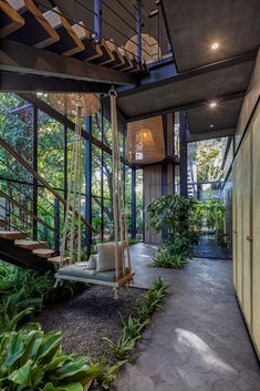 the inside of a house with lots of plants