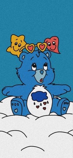 a blue teddy bear sitting in the snow with hearts on its head and eyes closed