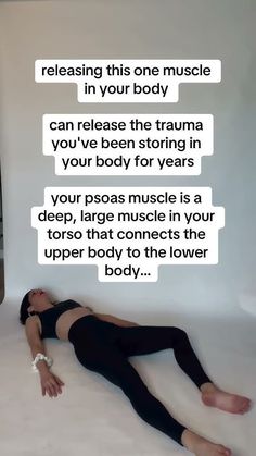 a woman laying on the floor with her arms behind her back and texting that reads, releasing this one muscle in your body can release the trama you've been