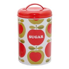 a red and white canister with an apple design on the lid that says sugar