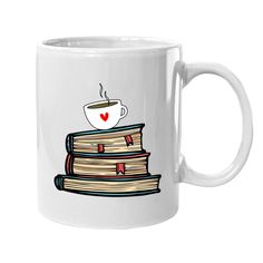 a white coffee mug with a stack of books and a heart on the top,