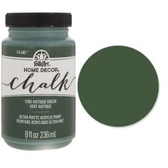 a bottle of dark green acrylic paint with the lid open to show it's color