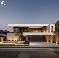 a modern house is lit up at night