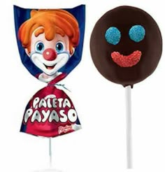 two lollipops with different designs on them, one has a clown face